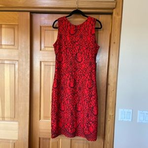 Red, sleeveless dress.
